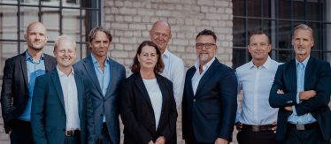 Grupp med mäklare för kommersiella fastigheter i Stockholm.